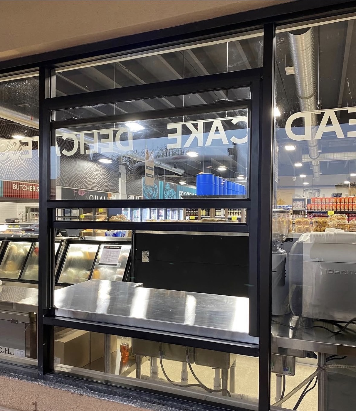 Replacement glass service window installed at a Miami market