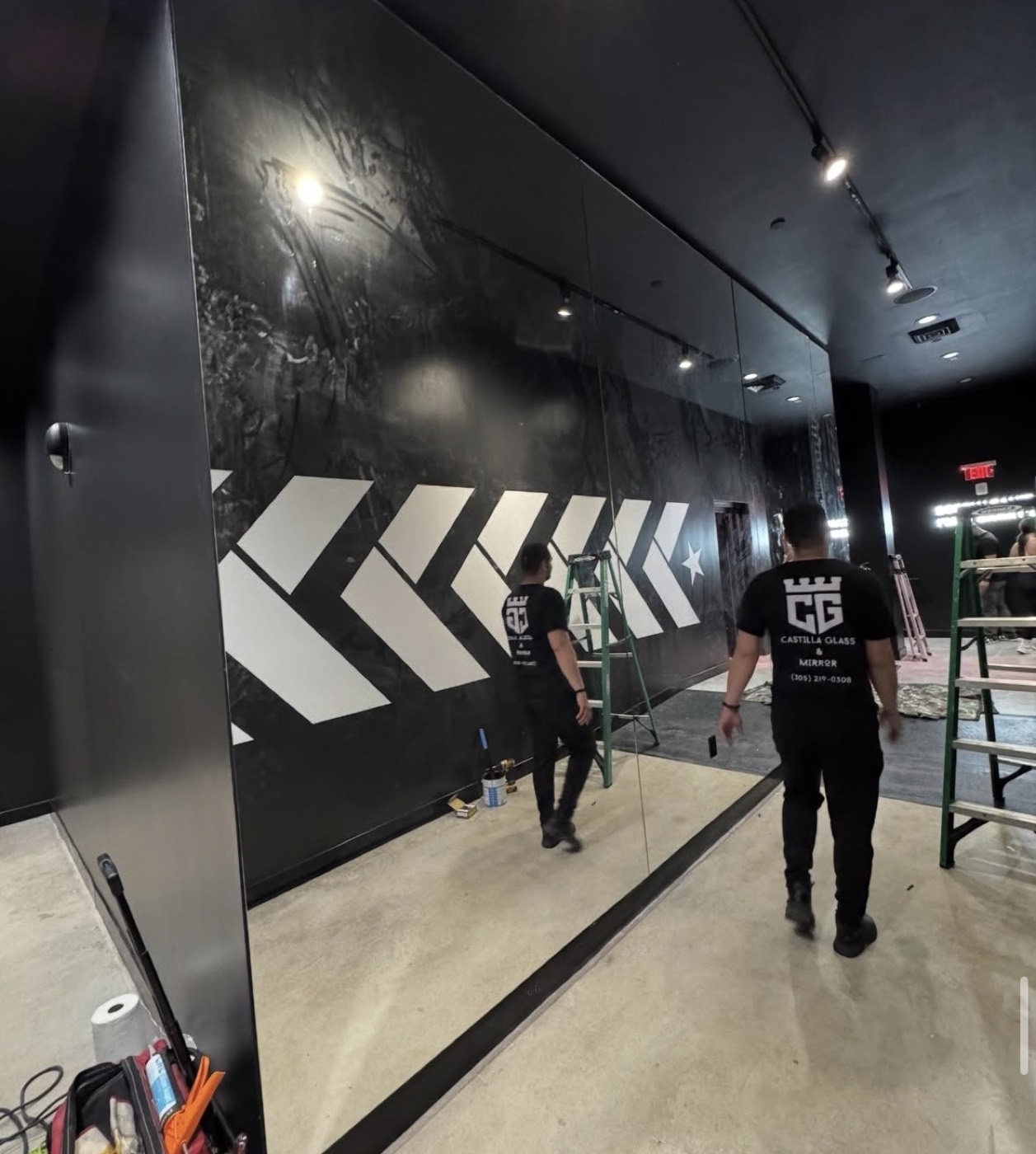 Castilla Glass crew installing a large mirror wall