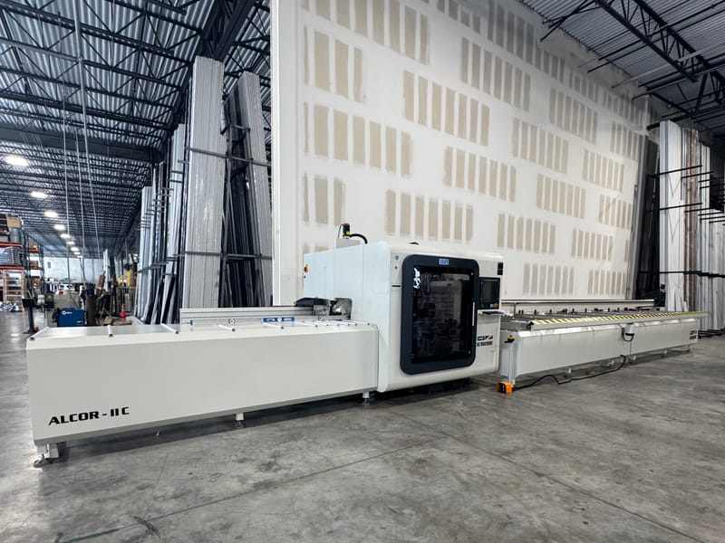 CNC machining center cutting aluminum frames at the V&V plant