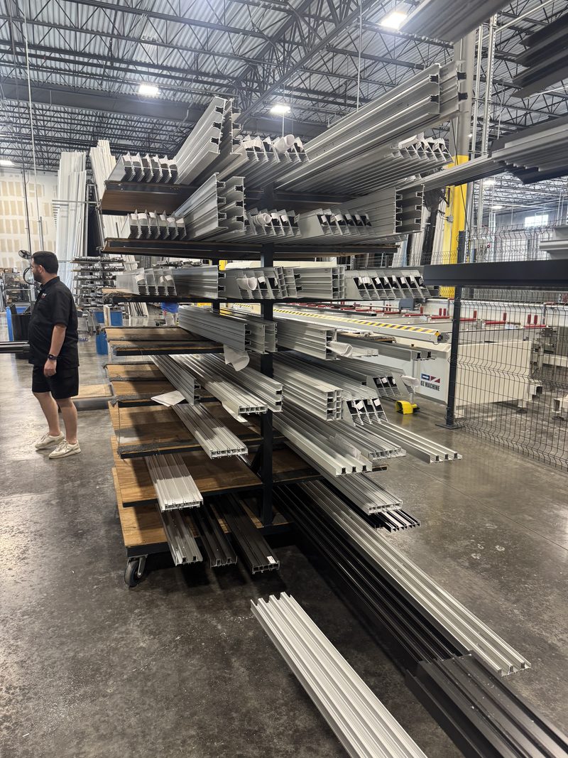 Aluminum window profiles on a rack at the V&V plant